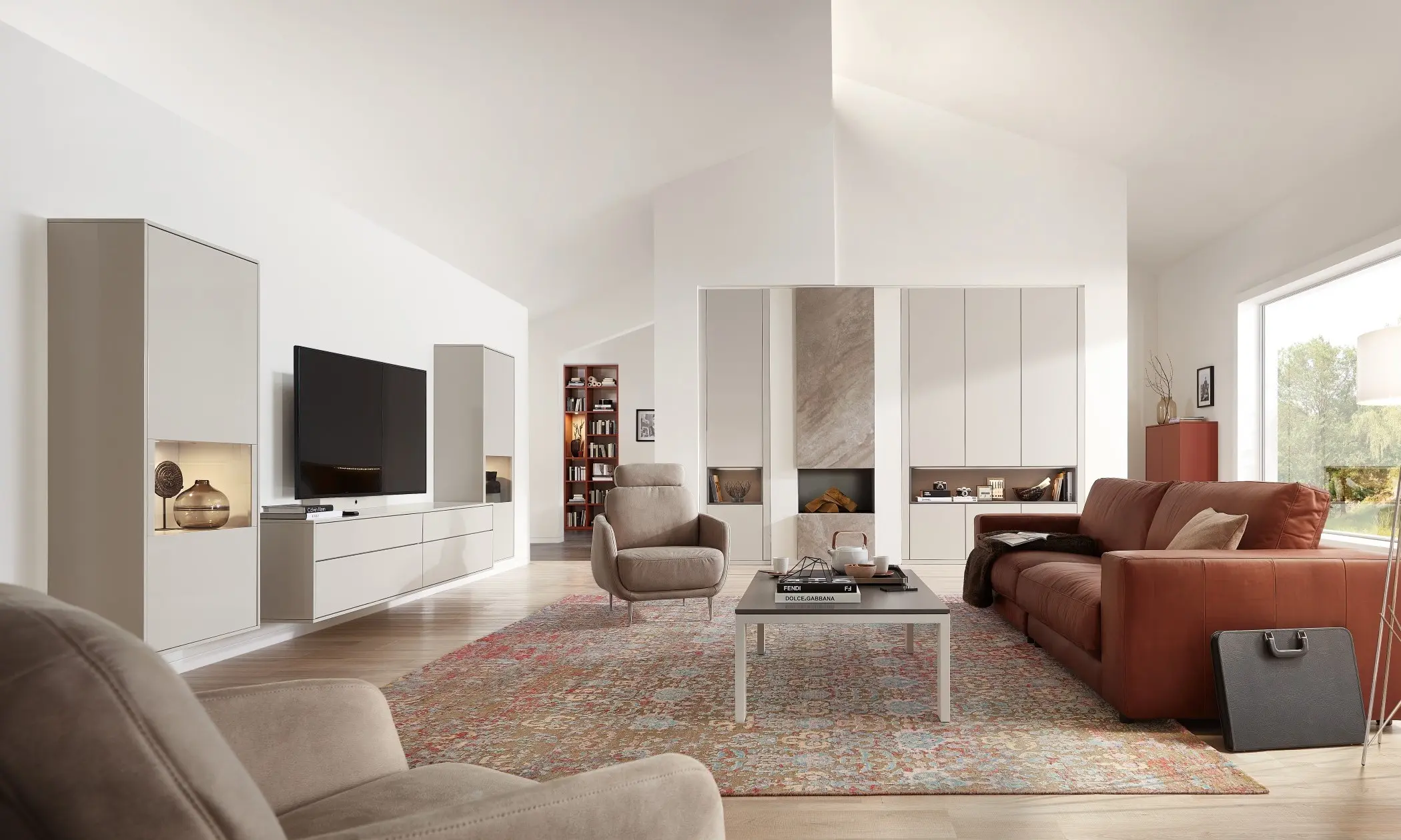 Man sieht ein Wohnzimmersystem in griffloser Variante mit Vitrinen die beleuchtet sind. Minimalismus trifft Glanz